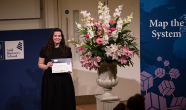 Roisin Dillon, Mount Royal University, holding Map the System 2018 Prize award